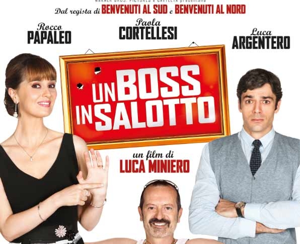 “Un boss in salotto”. Divertissement sulle nostre amare radici. Recensione. Clip